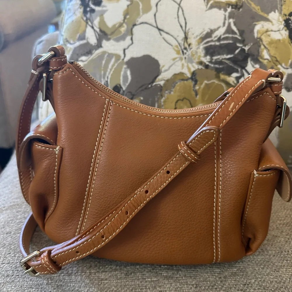 Dooney & Bourke Pebbled Grain Pocket Sac Crossbody with Side Pockets.